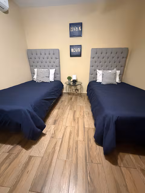 Bedroom with two twin beds, ideal for groups and work crews